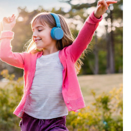 Child Dancing To Music Outside